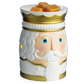 Freigestellte Nutcracker-Duftlampe in Weiß und Gold mit Nussknackergesicht und orangefarbenen Wachswürfeln in der Schale.