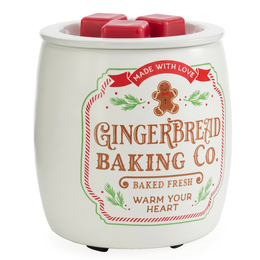 Weiße Gingerbread-Cookie-Duftlampe mit Lebkuchenmotiv, rot-grünen Details und roten Wachswürfeln in der Schale.